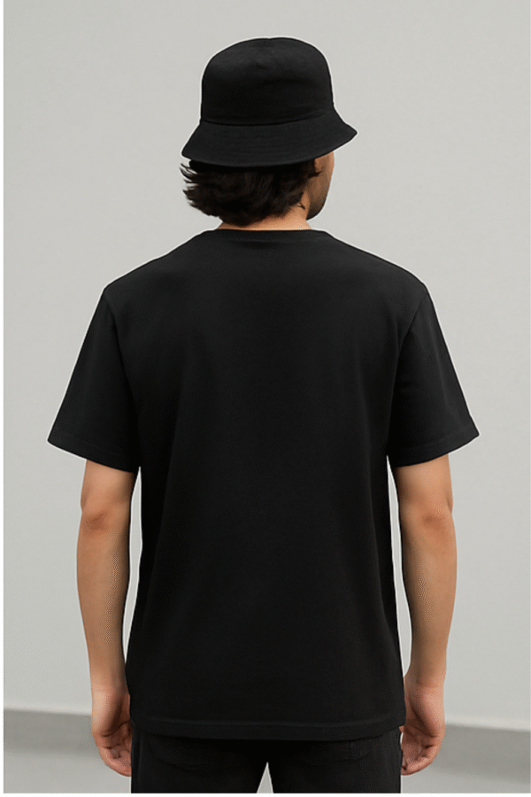 Black oversized T-shirt with yellow-red Tilak and Hindi word "सनातन" chest print – Kāntimay spiritual streetwear